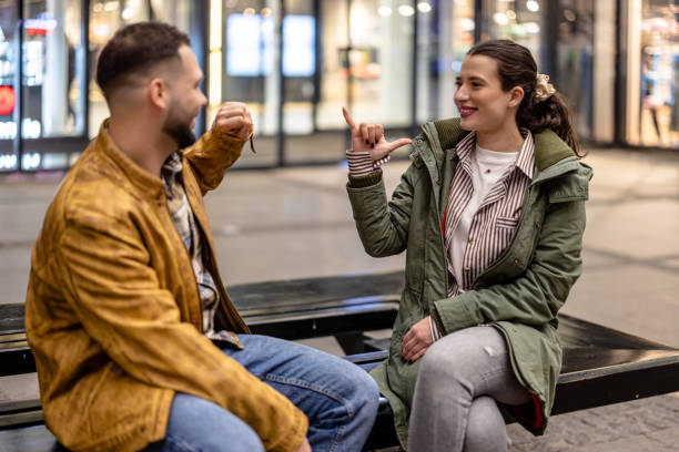 istock Young couple having a meaningful conversation in sign language 1503245302
