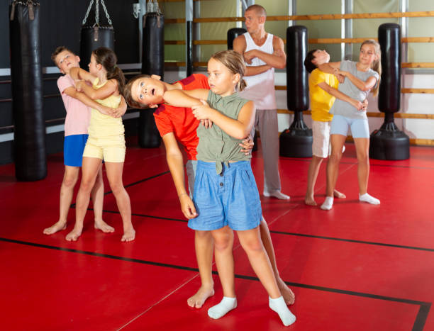 istock Kids in pairs training elbow strike 1503245836