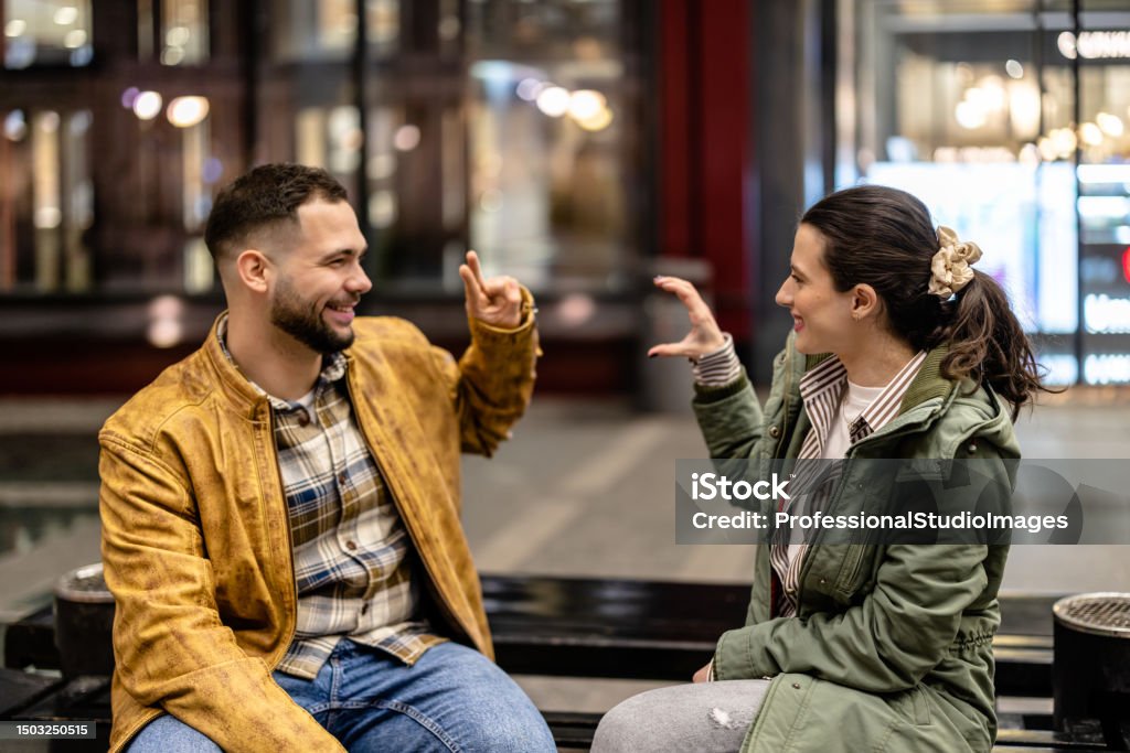 Couple In Sign Language Young Couple Enjoying A Conversation Through Sign Language Stock Photo ...