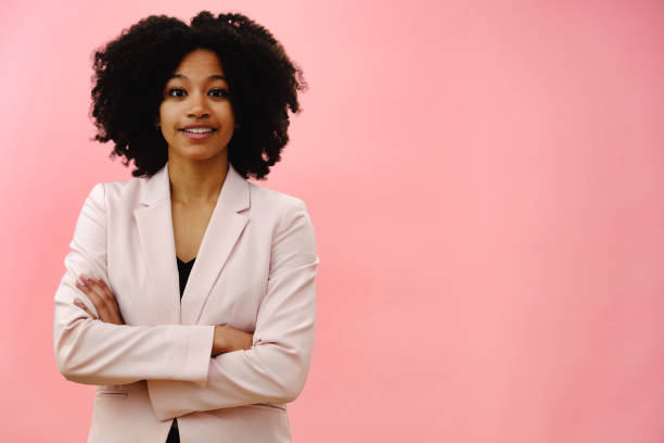 istock Woman wearing pink jacket with arms folded 1503253199