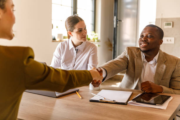 istock Candidate and interviewer shaking hands before a job interview meeting 1503253253