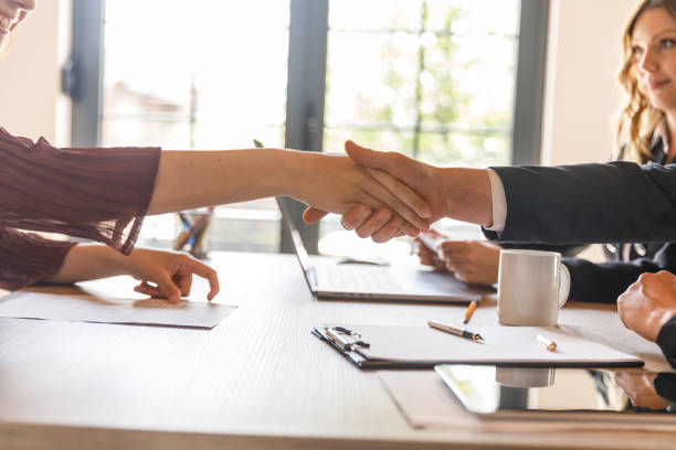 istock Interviewer and candidate shaking hands at the beginning of a job interview meeting 1503253361