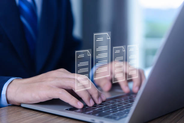 istock Businessman using laptop to manage documents paperless office 1503253784