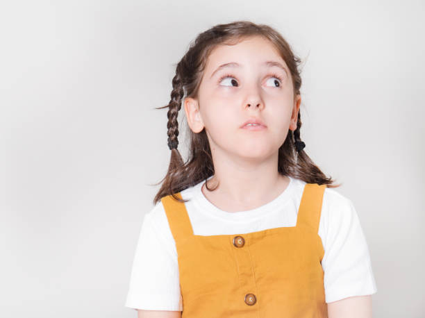 istock Thoughtful little girl looking away thinking 1503254338