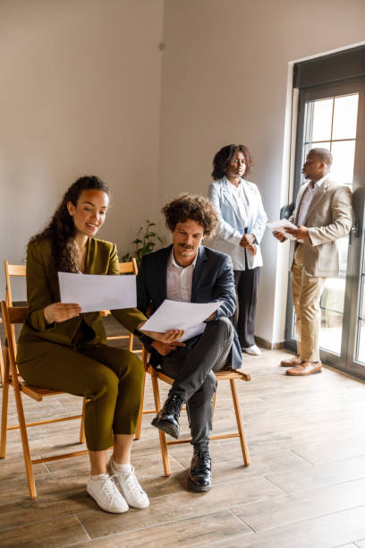 istock Business casually chatting while waiting for a job interview meeting 1503255925