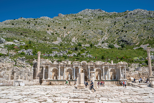 Sagalassos, Ağlasun, Burdur, Turkey- June 25, 2023: hikers are visiting the ruins of Sagalassos, are 7 km from Ağlasun, Burdur, in the Western Taurus mountains, at an altitude of 1450–1700 meters.