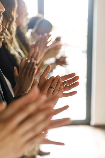 istock People standing in line, applauding together 1503256679