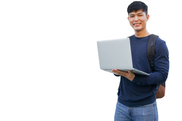 close up young asian student man use laptop computer to work about homework or do project about programming isolated on white background for teenage lifestyle in campus and education concept