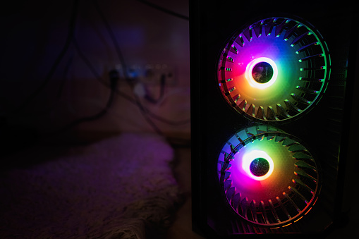 Gaming PC box with cooling setup and full RGB light inside.
