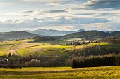 Stunning landscape with a winding road through a lush green valley Lower Silesia during golden hour