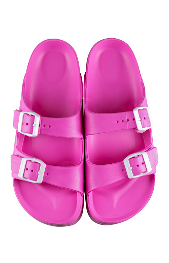Pink colored anatomic slippers made of foam, lightweight with two adjustable straps on buckles, waterproof, cutout, clipping path, isolated on white, studio shot