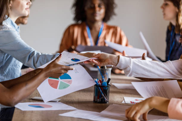 istock Business people exchanging documents during insightful meeting 1503264889