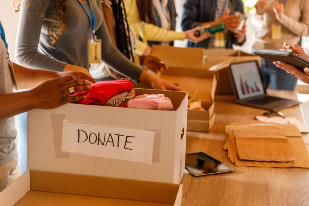 istock Volunteers working together to organize boxes with donations 1503273715