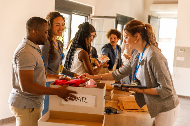 istock Volunteers working together to organize boxes with donations 1503273723