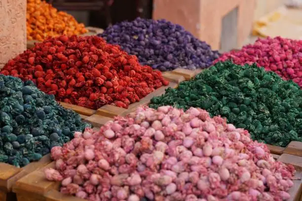 A closeup of vibrant-colored spices on a market in Marrakech, Morocco