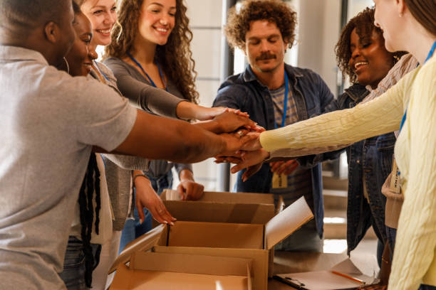 istock Group of volunteers putting their hands together in a stack 1503277938