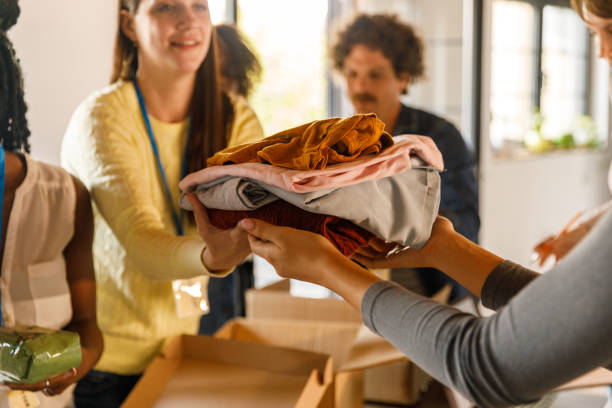 istock Group of volunteers preparing donation boxes with clothes 1503277943