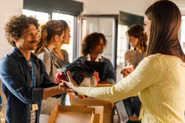 istock Group of volunteers preparing donation boxes with clothes 1503277944