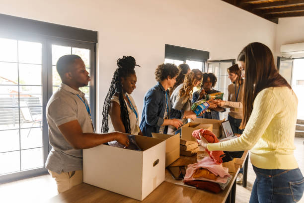 istock Group of volunteers preparing donation boxes with clothes 1503277961