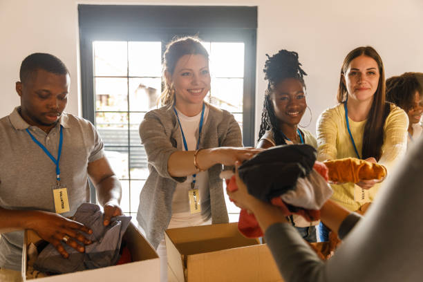 istock Group of volunteers preparing donation boxes with clothes 1503277962