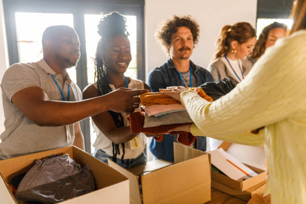 istock Group of volunteers preparing donation boxes with clothes 1503277964