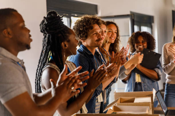 istock Group of volunteers applauding after successfully preparing donations 1503277971