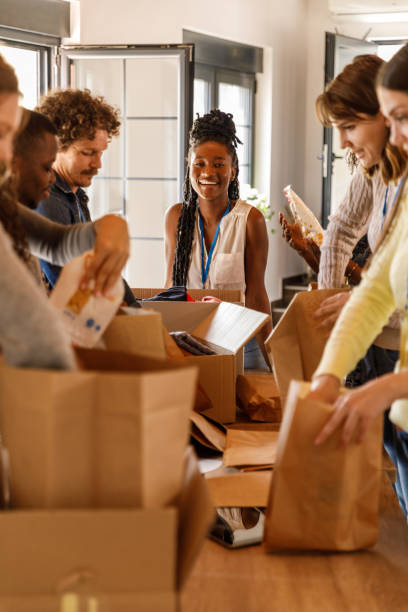 istock Volunteers creating care packages during a food drive 1503278045