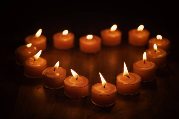 tealight candles in a shape of a heart, shallow focus photo