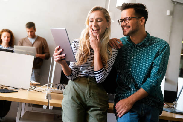istock Smiling diverse colleagues gather in boardroom brainstorm discuss financial statistics together 1503285631