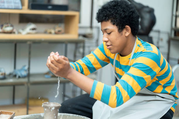 istock Artistic Journey: African American Boy Crafting Clay Art in Ceramic Studio 1503285781