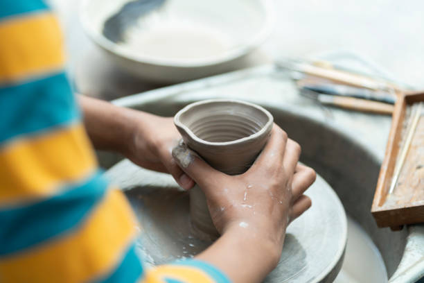 istock Artistic Expressions: African American Boy Creating Handmade Pottery in Studio 1503287424