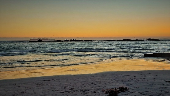 Sun going down at the beautiful Bloubergstrand beach (Big Bay), Cape Town, South Africa