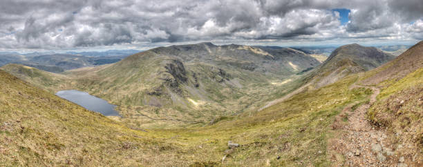 The View From Fairfield Taken from Fairfield in the Lake District looking towards Seat Sandal, Grisedale Tarn, Dollywagon Pike, Nethermost Pike, Helvellyn, Striding Edge, Birkhouse Moor, Ullswater, St Sunday Crag and Cofa Pike. striding edge stock pictures, royalty-free photos & images