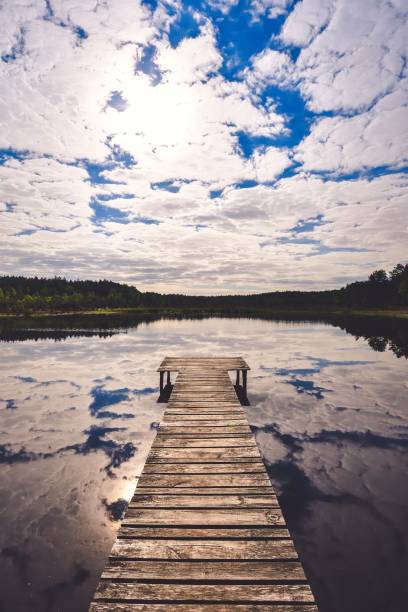 Charming wooden pier over a small lake in Michala Gora, Poland.