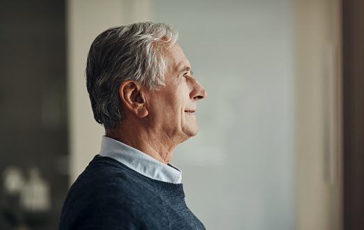 Elderly man, profile and thinking about future, retirement and pension with headshot, mockup space and aging. Male person at home, pensioner and relax, planning old age and memory of life experience