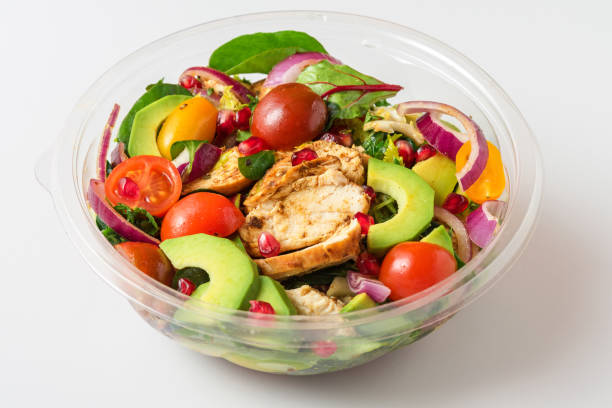 istock Healthy chicken salad with avocado, tomatoes and pomegranate in plastic package for take away or food delivery 1503298217