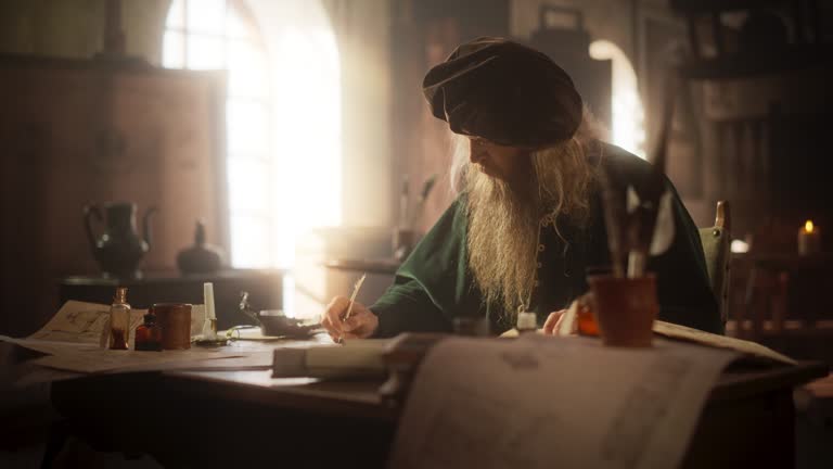 Portrait of an Old Renaissance Male Inventor Writing and Thinking about New Ideas. Dedicated Historian Taking Notes, Writing a Book about the Important and Innovative Eras in the History of Humanity