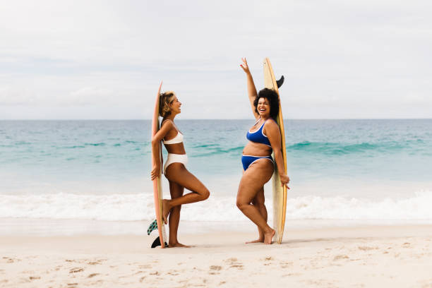 istock Fun on the beach: Female surfers celebrating after an exciting surfing trip 1503298737