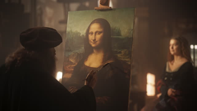 Re-enactment Documentary Scene for The Process of the Creation of the Mona Lisa Painting: The Genius Leonardo da Vinci Making the First Layer of Shadow in his Masterpiece on Canvas in his Art Workshop