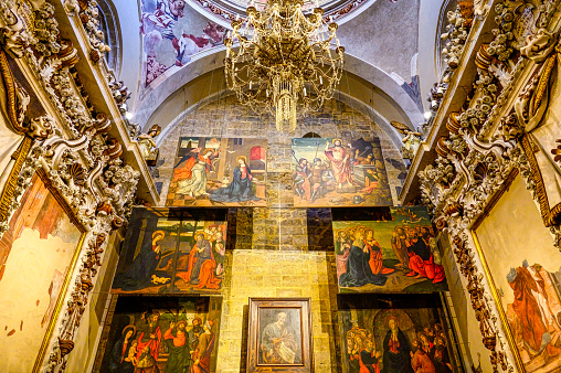 Valencia, Spain - July 15, 2022: Altar in the medieval cathedral. The Catholic church is an international landmark and a major tourist attraction