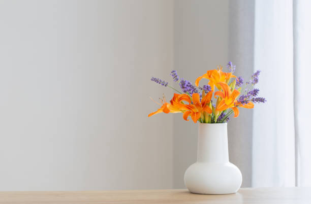 istock summer flowers in white jug on wooden shelf 1503311209