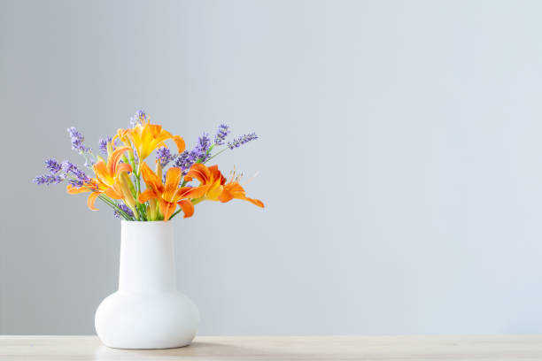 istock summer flowers in white jug on wooden shelf 1503311212