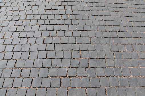 harmonic pattern of grey cobble stones in row
