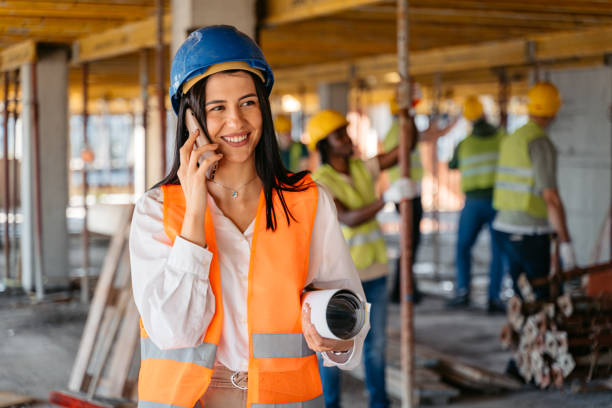 istock Female Engineer Talking On The Phone On A Construction Site 1503311744