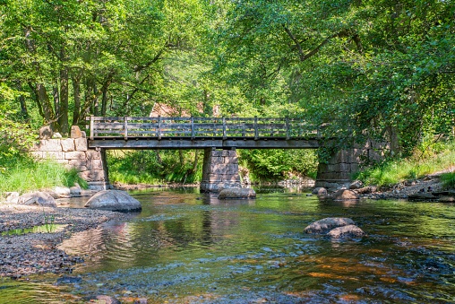 An old bridge over a pond in Lillesand, Norway