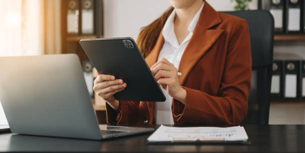 istock Confident businessw0man working on laptop,tablet and smartphone at her workplace at modern office. 1503315521