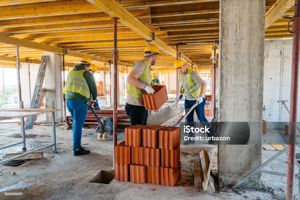 Work In Building Construction Construction Workers Working On A Construction Site Stock Photo ...