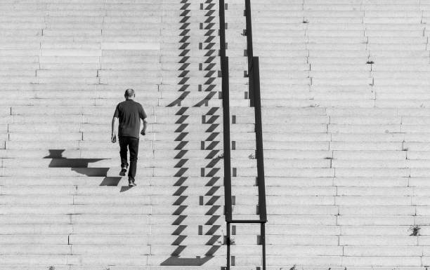 Rear view of a man climbing the stairs, Berlin Tiergarten