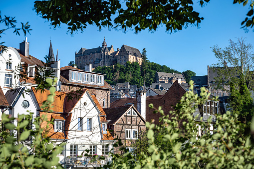 view on historic Marburg over Lahn river at blue summer morning with castle in the background