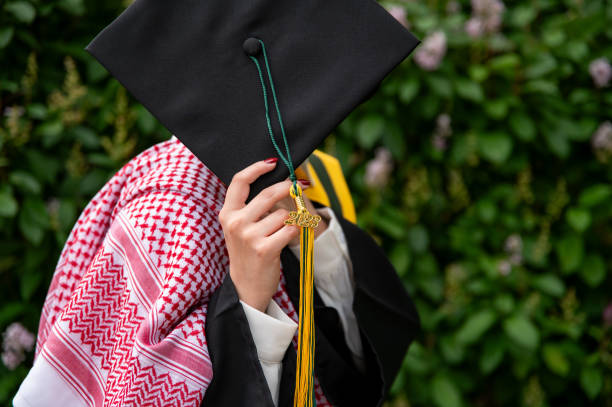 istock Young Woman Graduate in a Park 1503319275